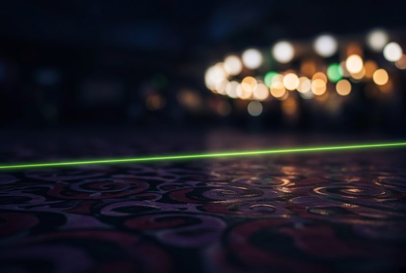 Abstract close-up of casino floor lighting with laser accents