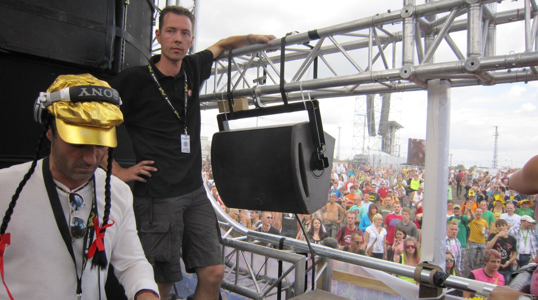 Las Vegas private party DJ Bruce Cullen in the DJ booth above a festival crowd